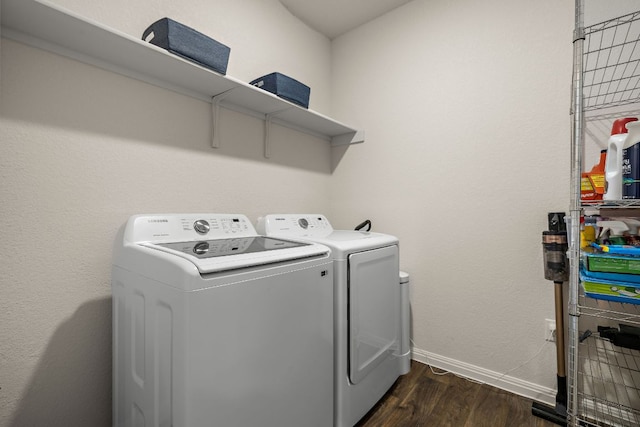 809 Cade Cv, Georgetown, TX 78626 - laundry area with washing machine and dryer, dark wood-style floors, and baseboards