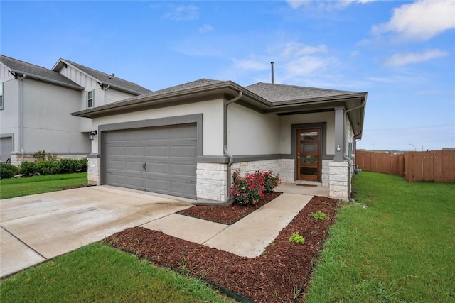 521 Rearing Mare Pass, Georgetown, TX 78626 - view of front of home featuring an attached garage, concrete driveway, stone siding, a shingled roof, and stucco siding