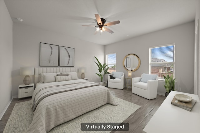521 Rearing Mare Pass, Georgetown, TX 78626 - bedroom with wood finished floors, baseboards, and a ceiling fan