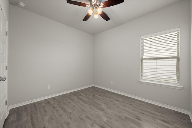 521 Rearing Mare Pass, Georgetown, TX 78626 - empty room featuring wood finished floors, baseboards, a smoke detector, and ceiling fan