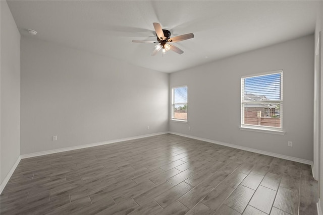 521 Rearing Mare Pass, Georgetown, TX 78626 - spare room with dark wood-style floors, ceiling fan, and baseboards