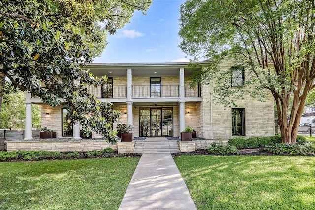 3317 Bowman Ave, Austin, TX 78703 - view of front of property with a balcony, a front lawn, and covered porch