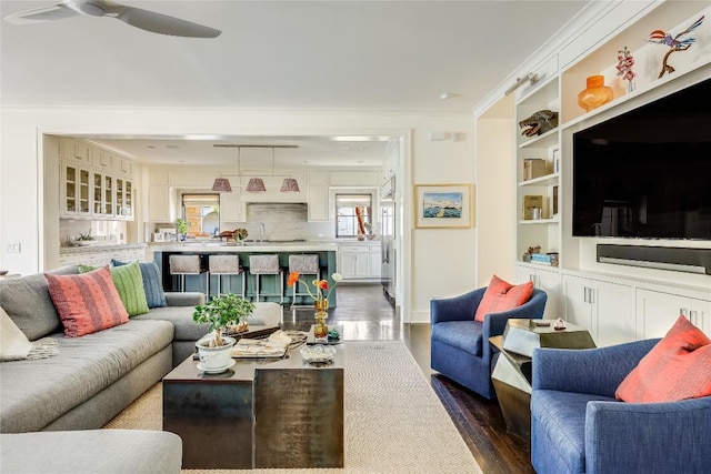 3317 Bowman Ave, Austin, TX 78703 - living room featuring dark wood-style floors, ceiling fan, and crown molding