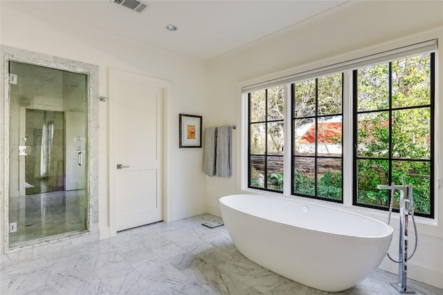 3317 Bowman Ave, Austin, TX 78703 - full bath with a soaking tub, a stall shower, and marble finish flooring