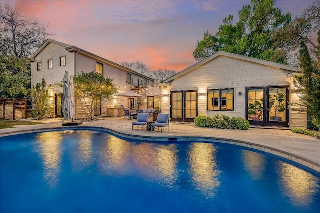 3317 Bowman Ave, Austin, TX 78703 - swimming pool with french doors and a patio area