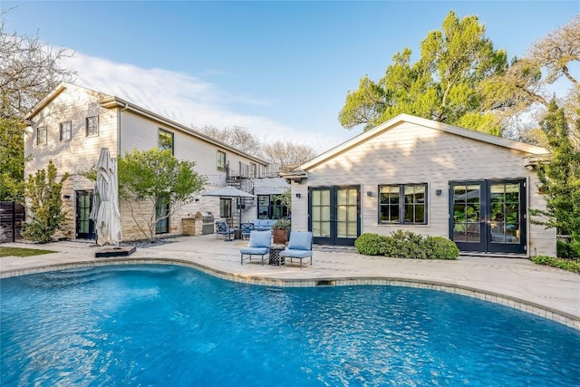 3317 Bowman Ave, Austin, TX 78703 - outdoor pool with french doors and a patio