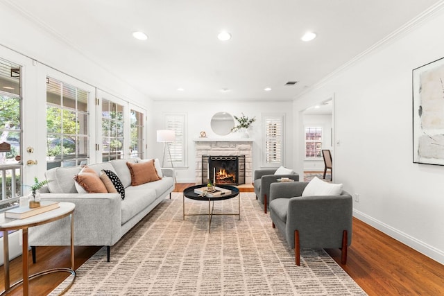 5401 Shoal Creek Blvd, Austin, TX 78756 - living room featuring crown molding, baseboards, wood finished floors, a fireplace, and recessed lighting