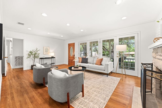 5401 Shoal Creek Blvd, Austin, TX 78756 - living area featuring a fireplace, healthy amount of natural light, recessed lighting, light wood-style flooring, and baseboards