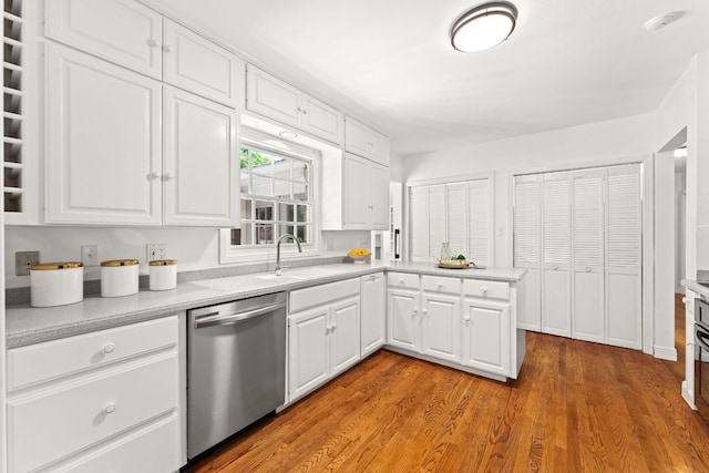 5401 Shoal Creek Blvd, Austin, TX 78756 - kitchen with dishwasher, a sink, white cabinetry, and light countertops
