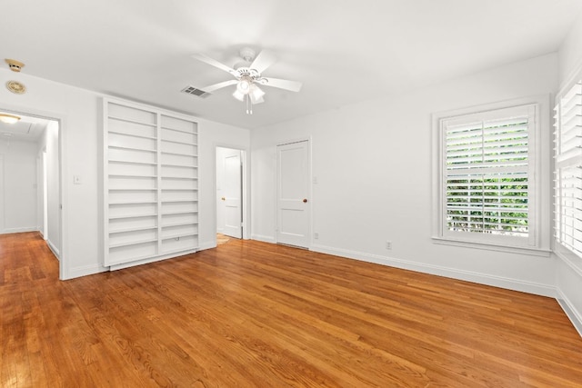 5401 Shoal Creek Blvd, Austin, TX 78756 - unfurnished bedroom featuring attic access, light wood-style flooring, baseboards, and a ceiling fan