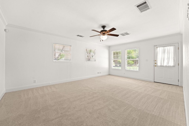 5401 Shoal Creek Blvd, Austin, TX 78756 - spare room featuring a ceiling fan, baseboards, ornamental molding, and light colored carpet