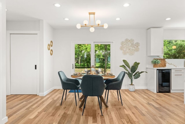 5102 Ravensdale Ln, Austin, TX 78723 - dining space featuring beverage cooler, plenty of natural light, light wood-style floors, recessed lighting, and a chandelier