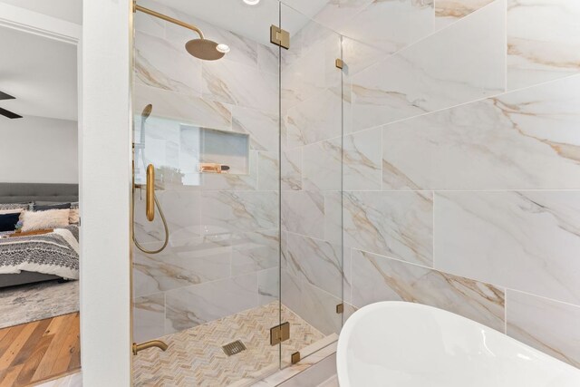 5102 Ravensdale Ln, Austin, TX 78723 - bathroom with ensuite bath, a freestanding bath, and a shower stall