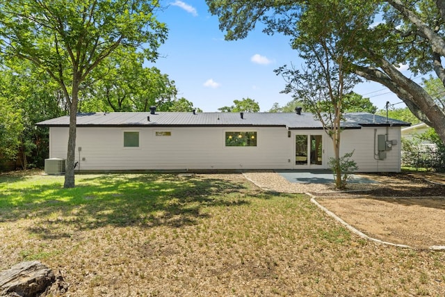 5102 Ravensdale Ln, Austin, TX 78723 - rear view of property featuring cooling unit, a patio, and a yard