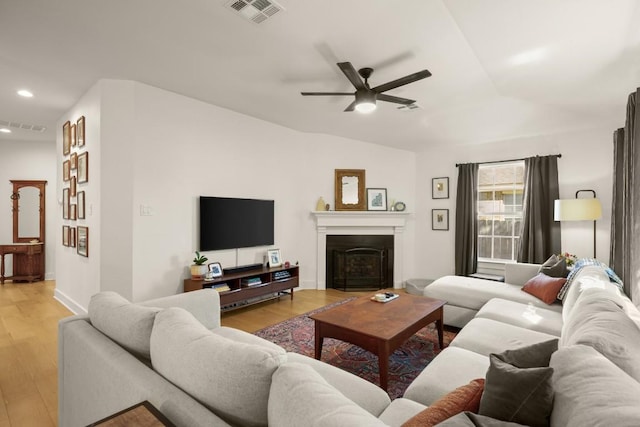 3400 Lynnbrook Dr, Austin, TX 78748 - living room featuring a ceiling fan, light wood-type flooring, recessed lighting, and a fireplace