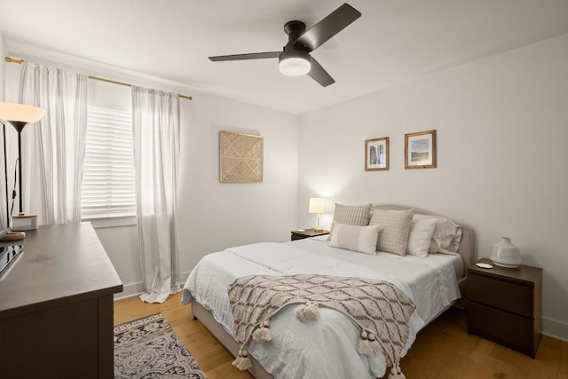 3400 Lynnbrook Dr, Austin, TX 78748 - bedroom with light wood finished floors, baseboards, and a ceiling fan