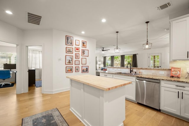 3400 Lynnbrook Dr, Austin, TX 78748 - kitchen with dishwasher, a sink, recessed lighting, a peninsula, and light wood-style floors