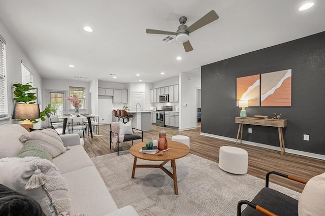 7809 Linnie Ln, Austin, TX 78724 - living area with a ceiling fan, recessed lighting, and light wood-style floors