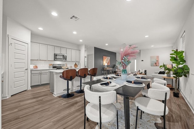 7809 Linnie Ln, Austin, TX 78724 - dining room with light wood-style floors and recessed lighting