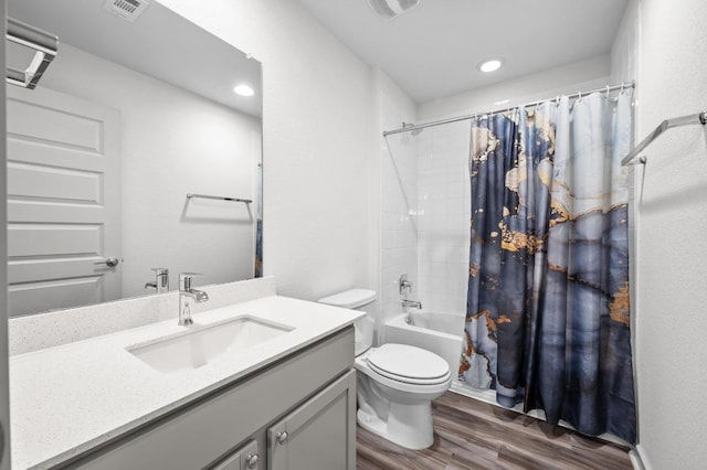 7809 Linnie Ln, Austin, TX 78724 - full bathroom featuring wood finished floors, vanity, shower / bath combination with curtain, and recessed lighting