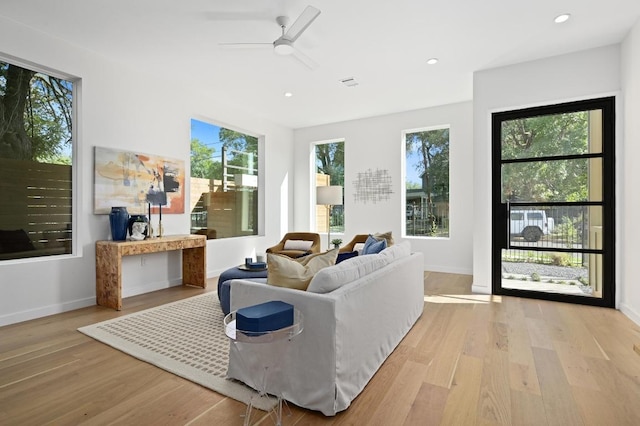 3507 Neal St Unit 1, Austin, TX 78702 - living area featuring light wood-style flooring, a ceiling fan, baseboards, and recessed lighting