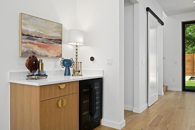 3507 Neal St Unit 1, Austin, TX 78702 - indoor dry bar with wine cooler, light wood-style floors, and baseboards