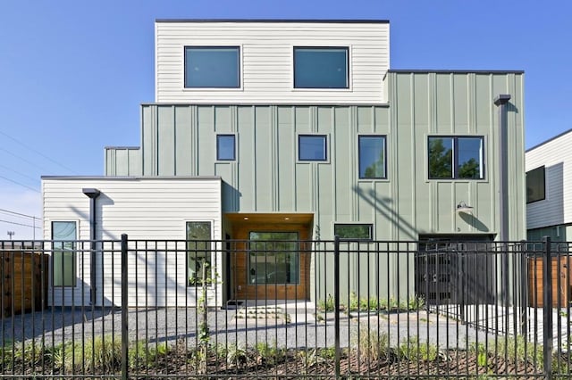 3507 Neal St Unit 1, Austin, TX 78702 - view of front of house with board and batten siding and a fenced front yard