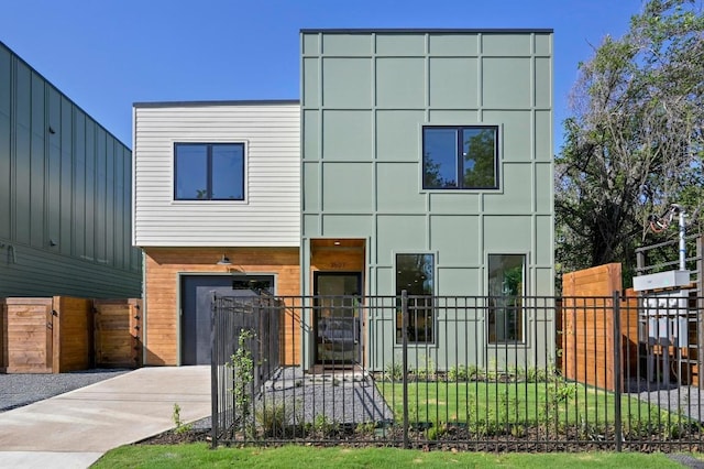 3507 Neal St Unit 1, Austin, TX 78702 - modern home with an attached garage and driveway