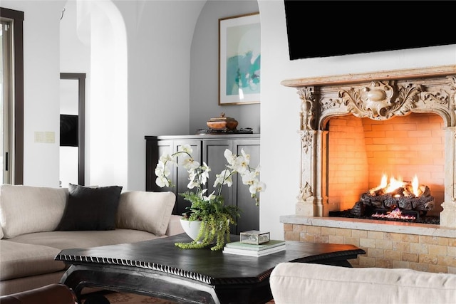 111 Piazza Vetta Dr, Austin, TX 78734 - living area featuring arched walkways and a lit fireplace