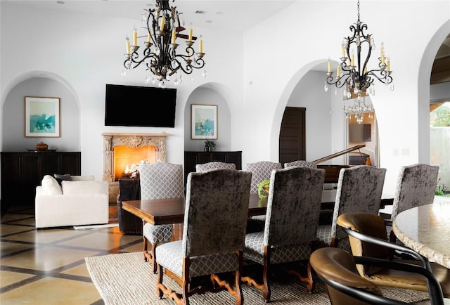 111 Piazza Vetta Dr, Austin, TX 78734 - dining area featuring a chandelier, arched walkways, and inlaid floor details