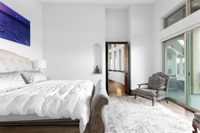 111 Piazza Vetta Dr, Austin, TX 78734 - bedroom with wood finished floors and a high ceiling