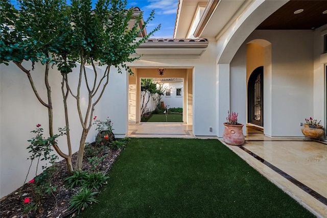 111 Piazza Vetta Dr, Austin, TX 78734 - property entrance with stucco siding and a lawn