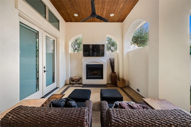 111 Piazza Vetta Dr, Austin, TX 78734 - view of patio / terrace with an outdoor living space with a fireplace and a ceiling fan