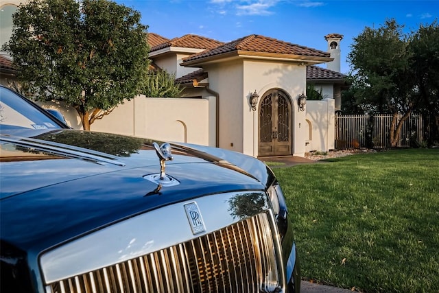 111 Piazza Vetta Dr, Austin, TX 78734 - view of front facade featuring a tiled roof, stucco siding, and french doors