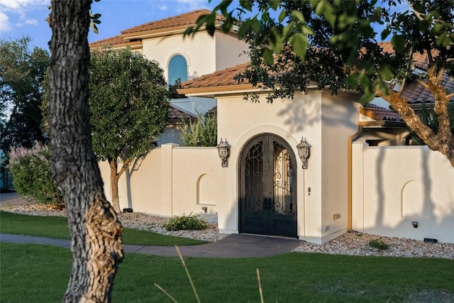 111 Piazza Vetta Dr, Austin, TX 78734 - view of front facade with a tile roof, stucco siding, and a front yard