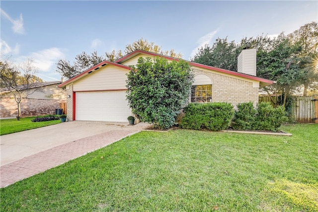 4303 Tamarack Trl, Austin, TX 78727 - ranch-style home with brick siding, a chimney, an attached garage, and driveway