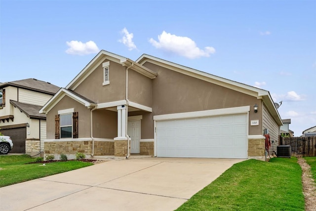 120 Flexus Ln, Liberty Hill, TX 78642 - view of front facade with stone siding, a garage, concrete driveway, stucco siding, and central AC