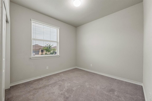 120 Flexus Ln, Liberty Hill, TX 78642 - carpeted empty room featuring baseboards