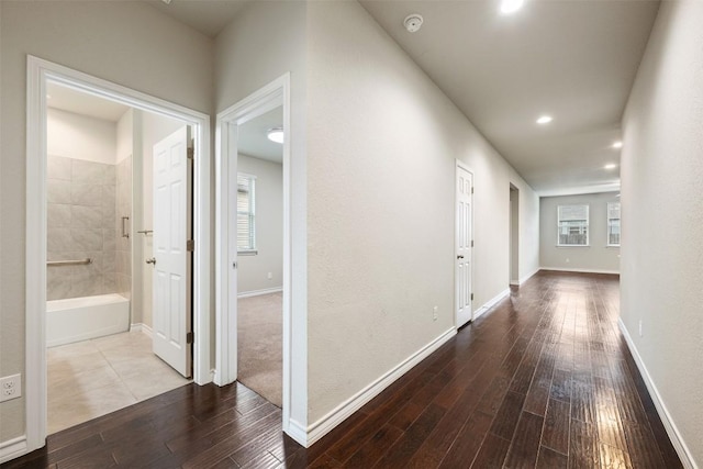 120 Flexus Ln, Liberty Hill, TX 78642 - hallway featuring dark wood finished floors, baseboards, and recessed lighting