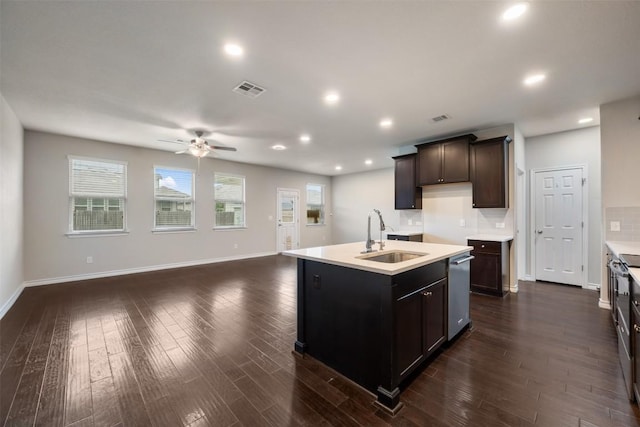 120 Flexus Ln, Liberty Hill, TX 78642 - kitchen with a sink, ceiling fan, stainless steel dishwasher, dark wood-style flooring, and open floor plan