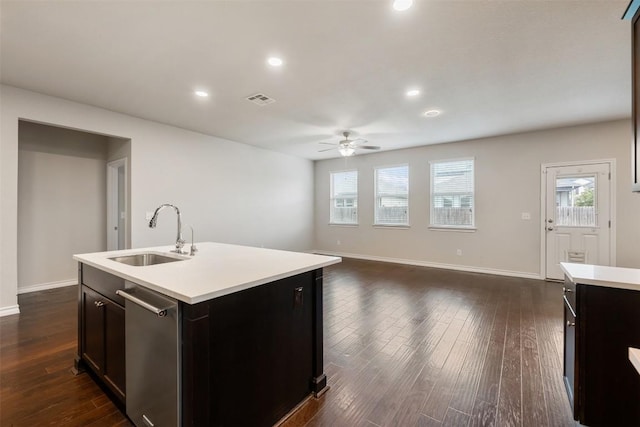 120 Flexus Ln, Liberty Hill, TX 78642 - kitchen with a sink, ceiling fan, light countertops, baseboards, and dark wood-style floors
