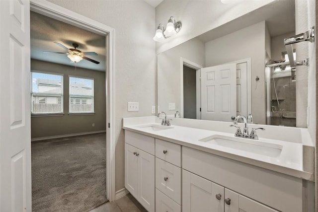 120 Flexus Ln, Liberty Hill, TX 78642 - full bath with double vanity, ceiling fan, a shower stall, and baseboards