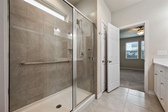 120 Flexus Ln, Liberty Hill, TX 78642 - bathroom featuring a shower stall, ceiling fan, vanity, and tile patterned flooring