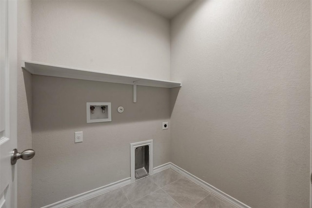 120 Flexus Ln, Liberty Hill, TX 78642 - washroom with hookup for an electric dryer, gas dryer hookup, hookup for a washing machine, light tile patterned flooring, and baseboards