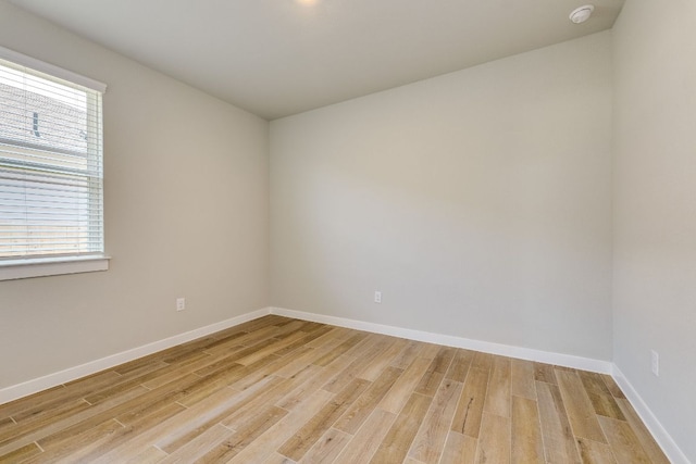 110 Denali Dr, Kyle, TX 78640 - unfurnished room with light wood-style flooring, baseboards, and a smoke detector