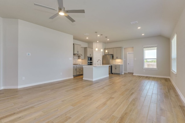 110 Denali Dr, Kyle, TX 78640 - unfurnished living room with a sink, light wood-style flooring, recessed lighting, a ceiling fan, and baseboards