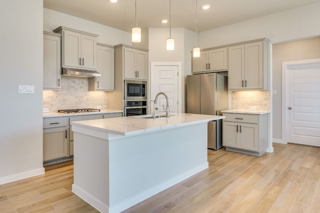 110 Denali Dr, Kyle, TX 78640 - kitchen featuring a sink, stainless steel appliances, under cabinet range hood, gray cabinetry, and recessed lighting
