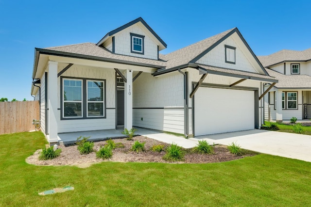 110 Denali Dr, Kyle, TX 78640 - view of front of property with a shingled roof, an attached garage, concrete driveway, and a porch