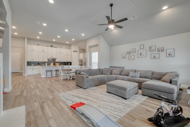 441 Double Eagle Ranch Dr, Cedar Creek, TX 78612 - living area with light wood-type flooring, a ceiling fan, recessed lighting, and lofted ceiling