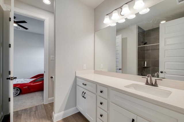 441 Double Eagle Ranch Dr, Cedar Creek, TX 78612 - full bathroom featuring wood finished floors, a tile shower, vanity, and ensuite bathroom